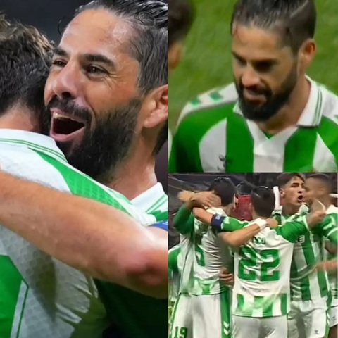 Các cầu thủ Betis chạy tới ôm Isco sau pha kiến tạo ở bàn thắng thứ hai